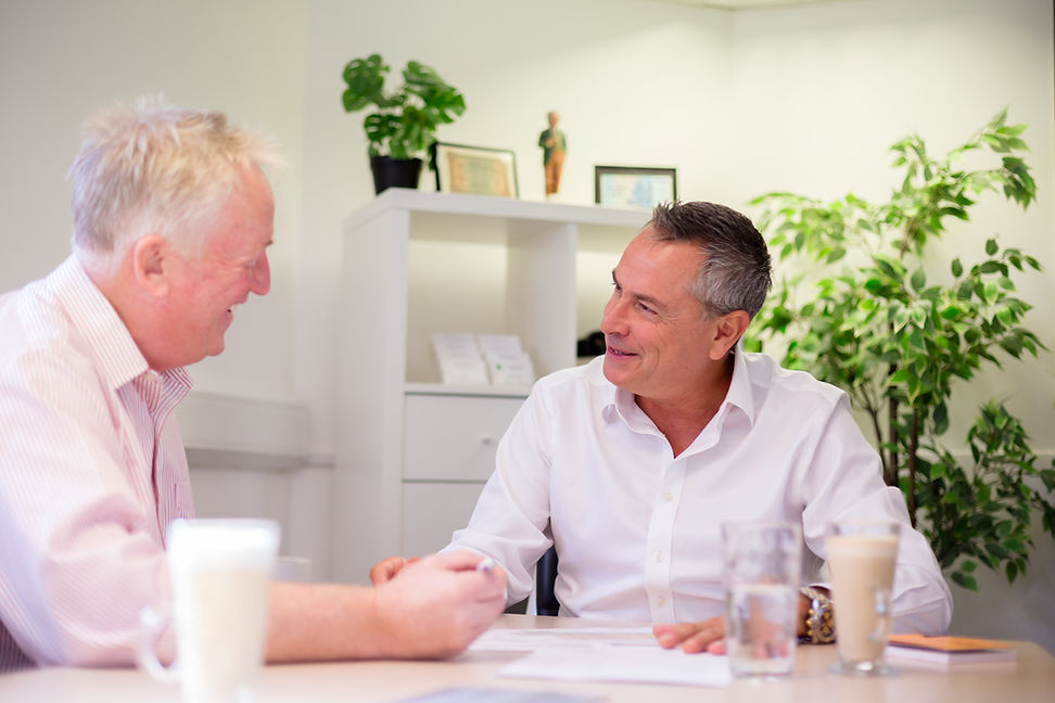 Business man working with client during a photoshoot in Essex