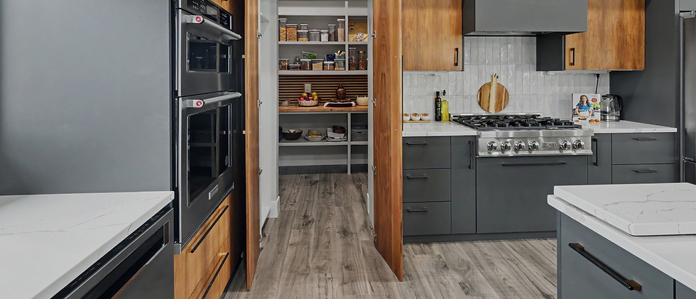 Modern kitchen with walk-in pantry by high end real estate broker
