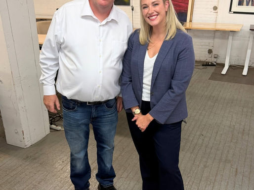 JP and Hannah Flood standing together before an interview