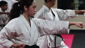 Women practicing stepping in punch.