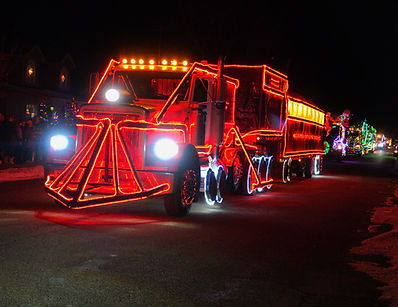 A custom semi-truck decorated as the Polar Express train with thousands of Christmas lights during the Belgrade, Montana Christmas Convoy parade.