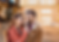Latinx couple smiling at each other in embodied relationship