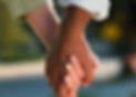 Mixed Couple holding hands in embodied relationship