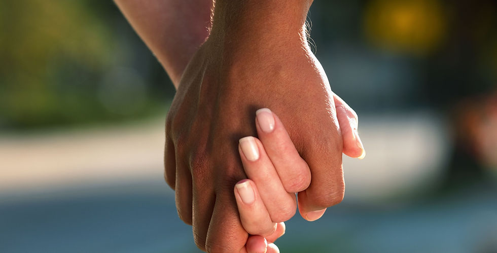 Diverse Couple holding hands in embodied relationship