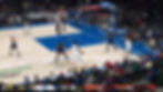 Video game basketball scene, player dribbling on blue court. Crowd watches. Scoreboard: 14-12, 2nd quarter, 3:39 left.