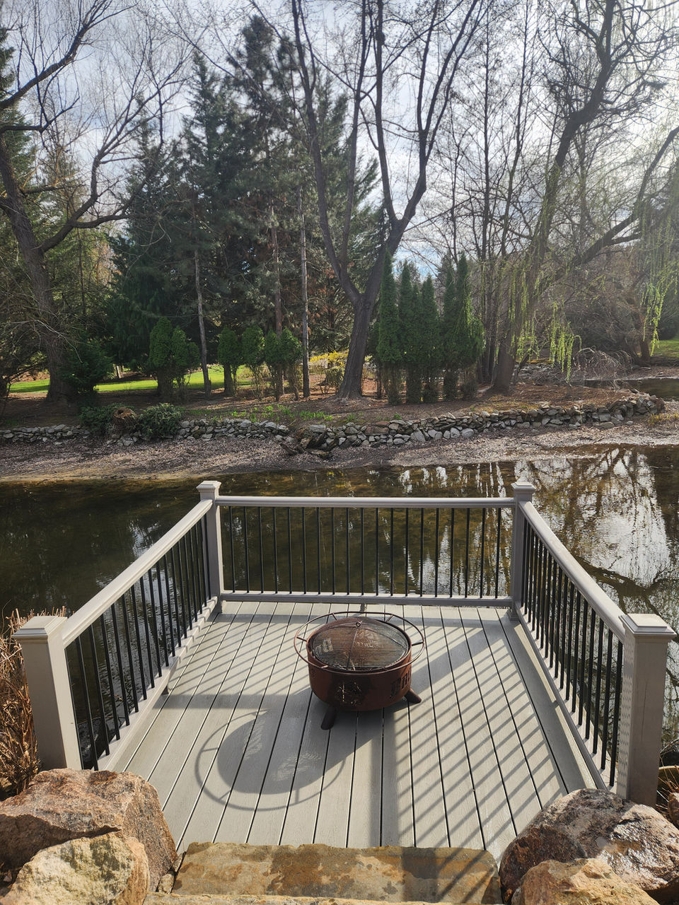 Pressure washed waterfront deck with fire pit, Garden City Idaho.