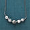 Miniature : Collier perles howlite naturelle entretoises argent tibétain