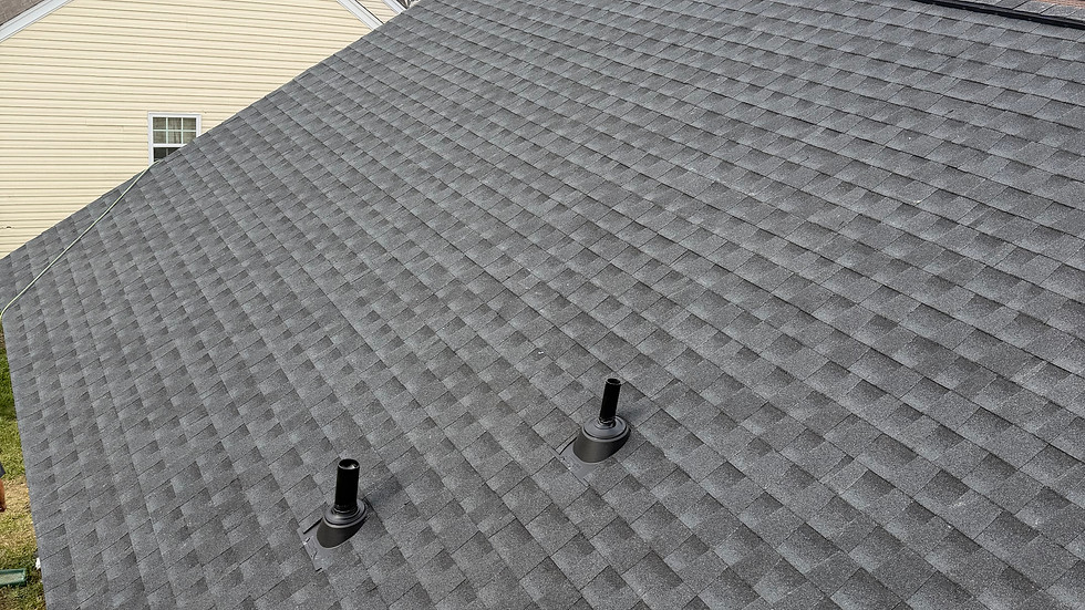 Newly installed charcoal asphalt shingle roof replacement.