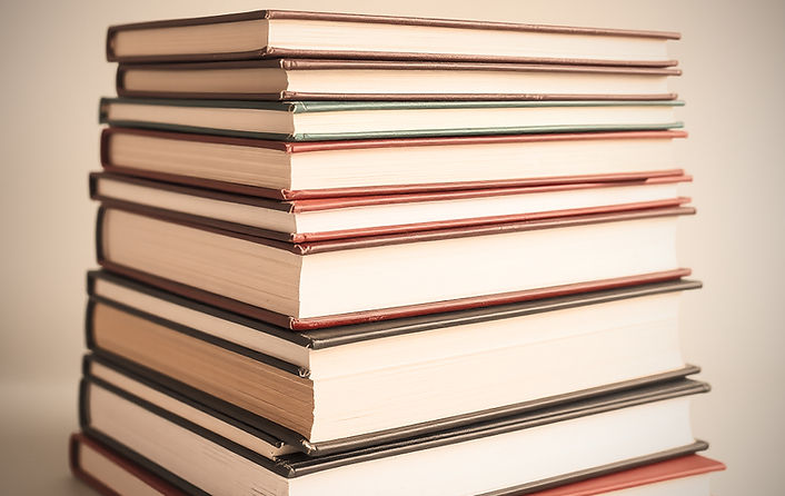 stack of books with no spines showing.jpg
