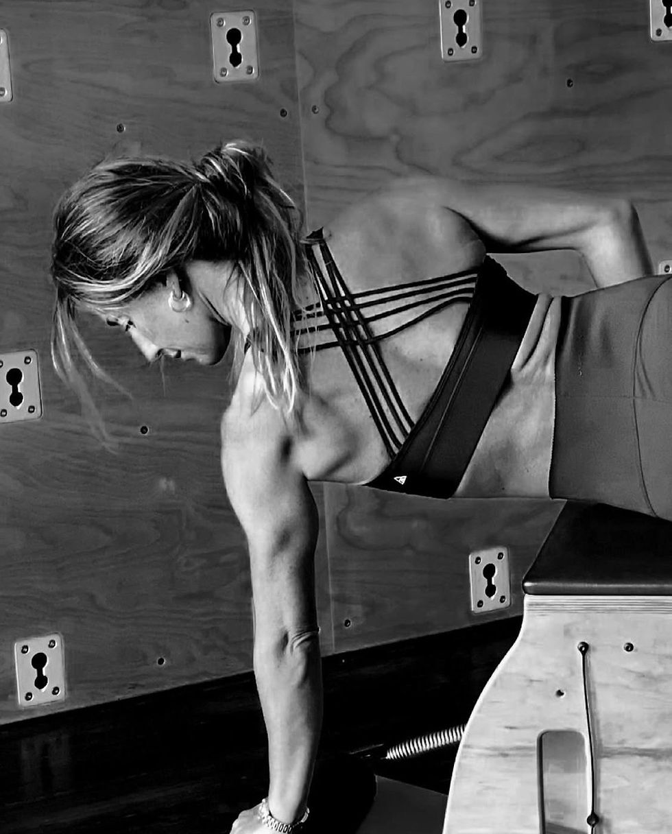 Pilates Instructor using a Pilates chair