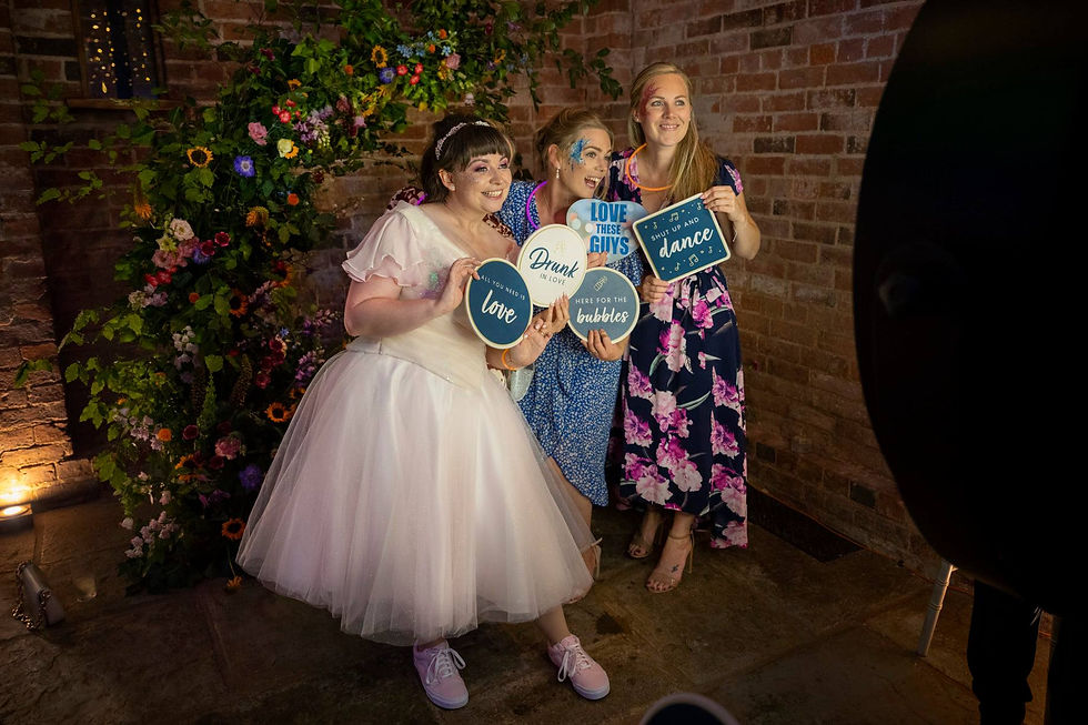 2 guests and a bride at the photo booth at Mickleton Hill