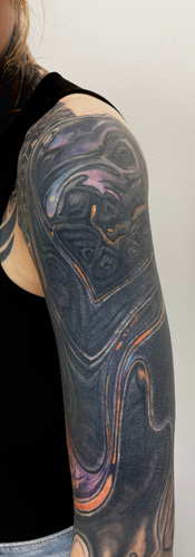 settled black out tattoo and color overlay healed