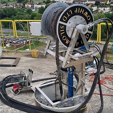 A reel with cables on a rooftop, used for industrial purposes