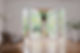 woman opening white frame bi-fold doors