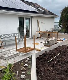 dug up soil outside of a garden room
