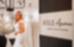 An image of aisle avenue bridal outlet's store, with a bride in the background