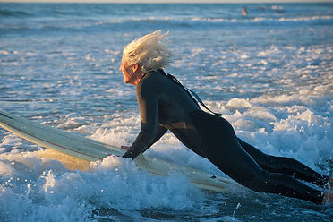 Paid Gettys Woman on surfboard.jpg