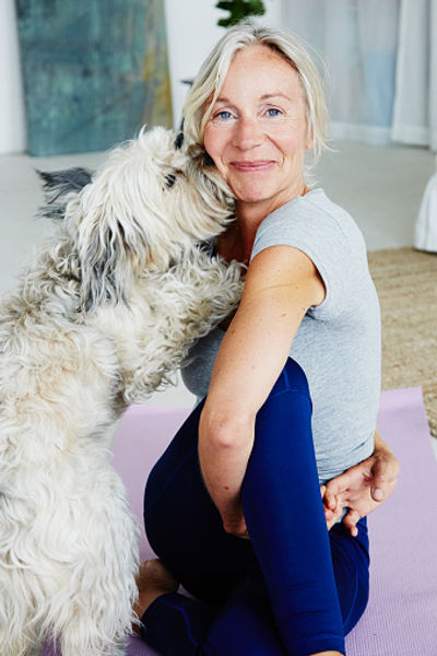 gettys comp woman stretching with dog.jpg