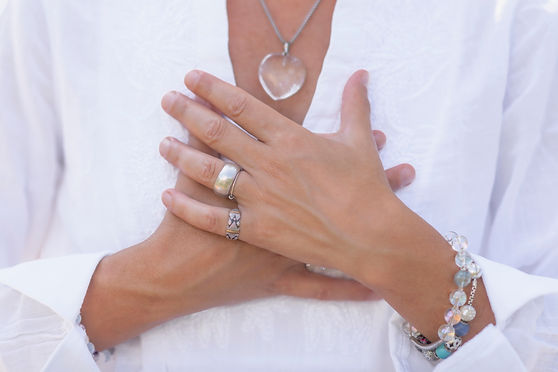paid shutterstock woman in white with hands on heart.jpg