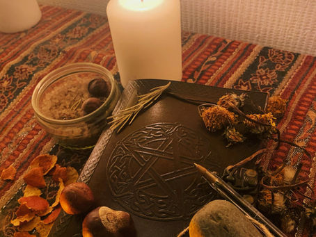 magical journal, witchcraft supplies, salt, candle, herbs