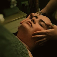 Lady Having a Relaxing Lymphatic Drainage Aromatherapy Holistic Face Massage