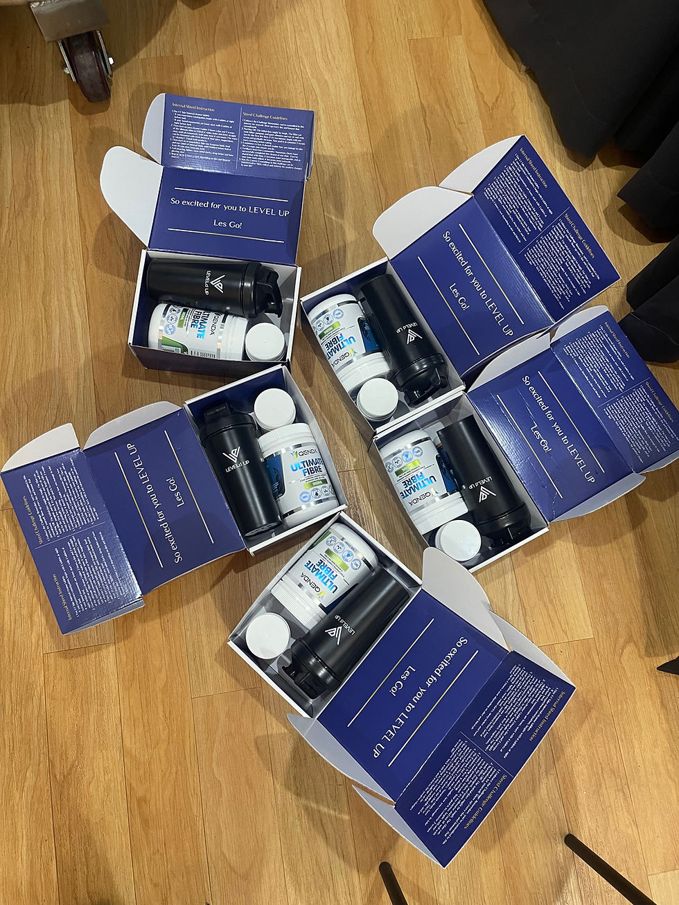 Close-up view of detox supplements and herbal teas arranged on a wooden table