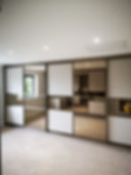 Storage space with sliding mirror panels