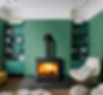 A fireplace in a green room
