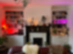 Unique shelving surrounding fireplace and mantelpiece