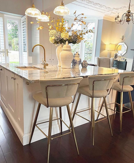 brightly lit kitchen with marble worktops