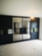 Modern storage units in black with sliding doors