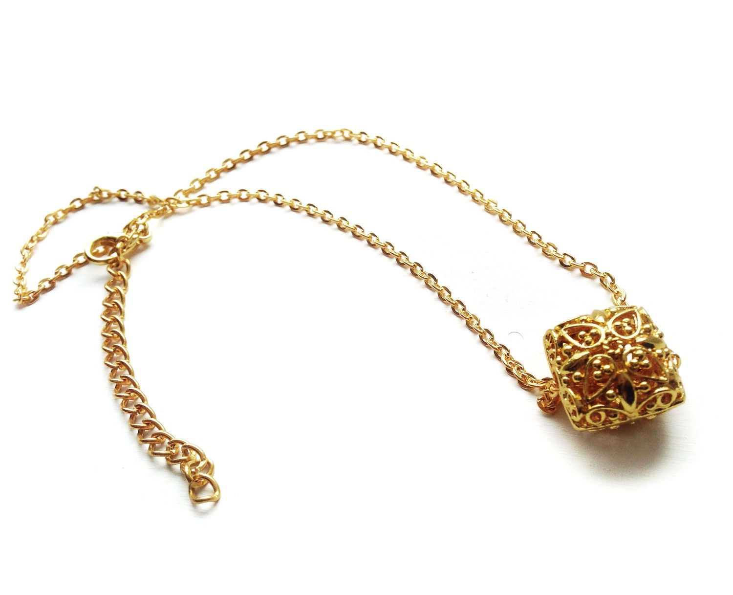 Gold square floral pendant necklace on a dainty gold chain 