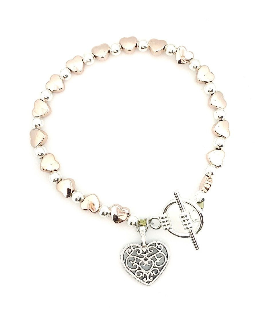 Thumbnail: Dainty rose gold heart charm bracelet with silver toggle clasp and heart charm