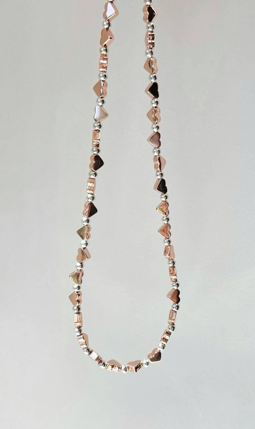 Thumbnail: Dainty rose gold and silver heart bead choker necklace with rose gold vermeil 