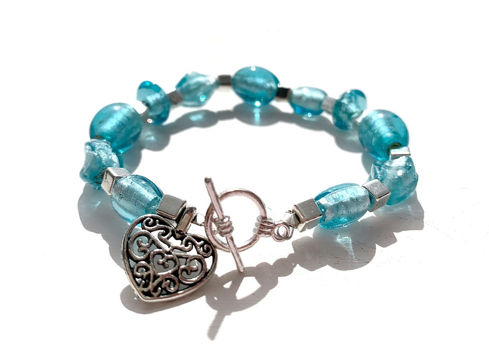Thumbnail: Blue beaded friendship bracelet with silver love heart charm and toggle clasp