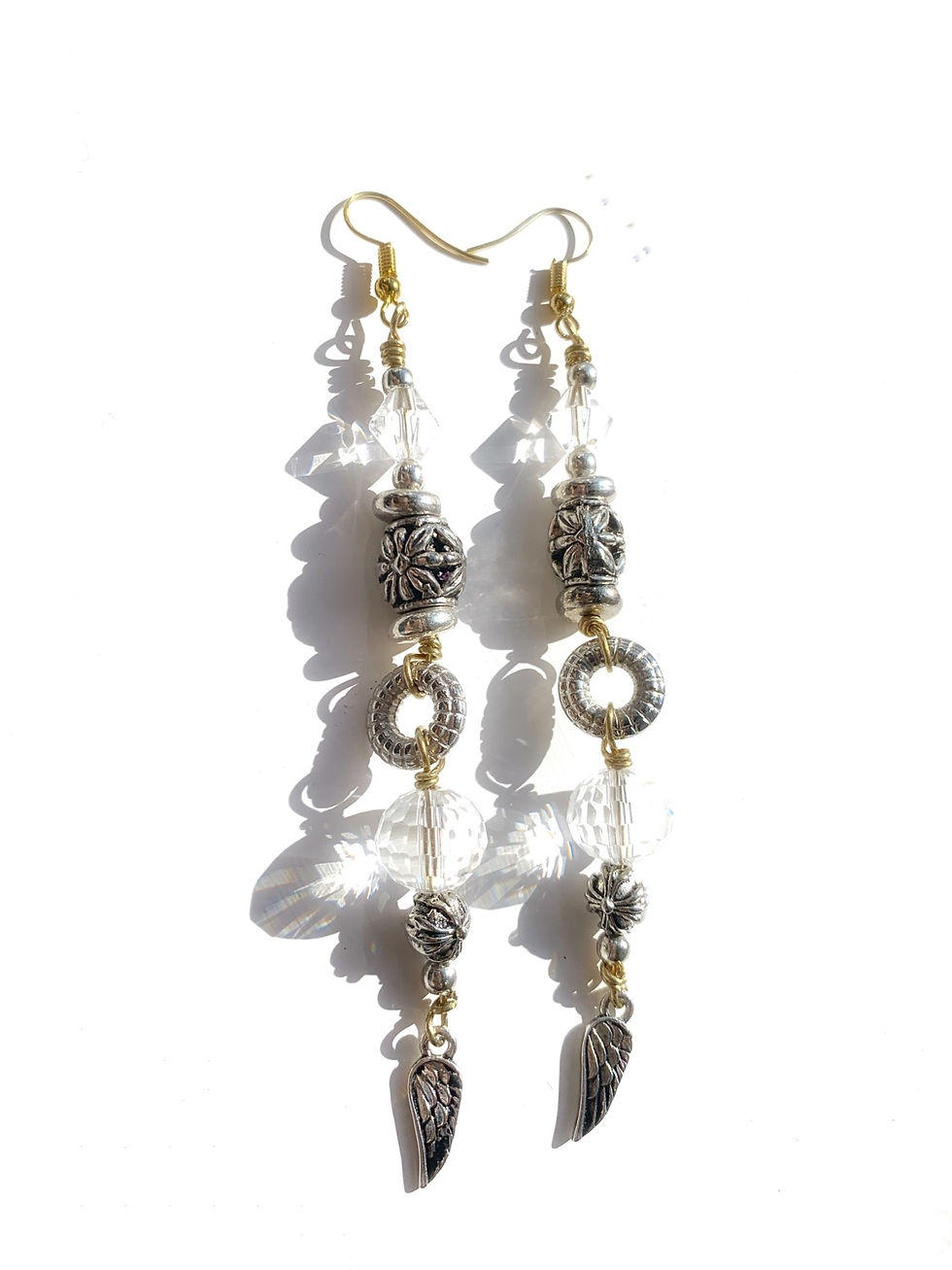 Thumbnail: Statement drop earrings in silver with angel wing charm detail 