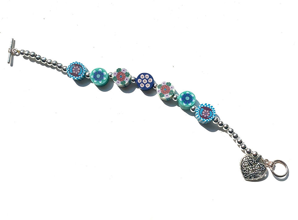 Thumbnail: Children’s floral dainty beaded bracelet with silver heart charm 