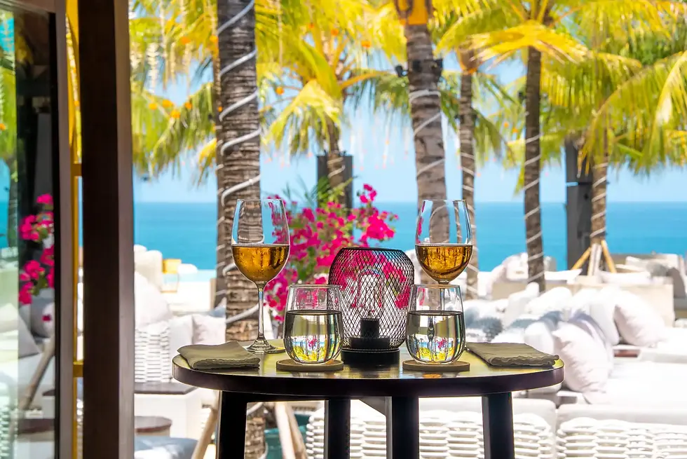 Romantic oceanfront dining at El Kabron Bali featuring Mediterranean seafood, elegant outdoor seating and panoramic sunset views over the Uluwatu cliffs.