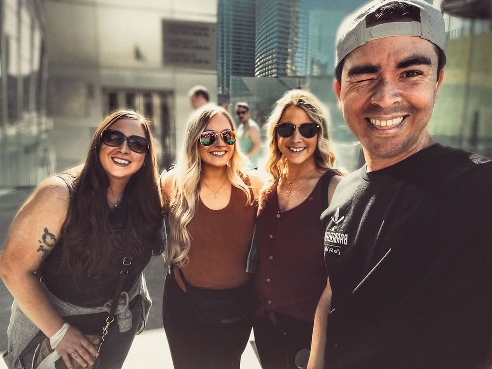 Las Vegas tour guide with small girls trip group on Strip during daytime walking tour