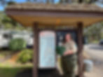 Park Ranger Becca Givens holding sand sifters outside our new supply hub in South Beach Newport