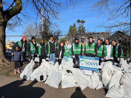 Group of volunteers showing the impact they made for Martin Luther King Jr. Day 2025