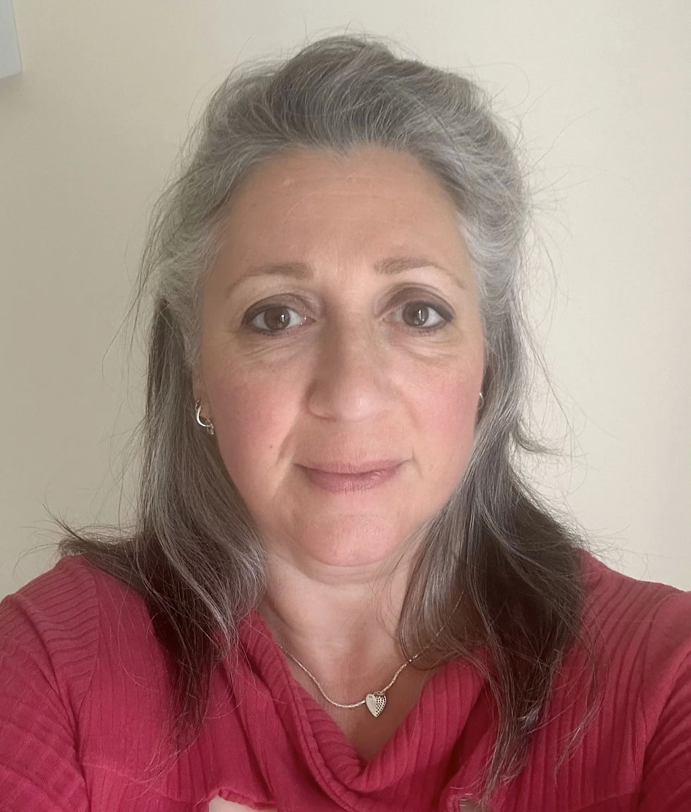 A woman smiling, wearing a red top