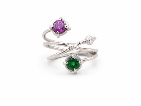 Universe/Infinite inspired engagement ring
in 18k White Gold, with a beautiful royal purple Garnet, green Tourmaline and white Sapphire