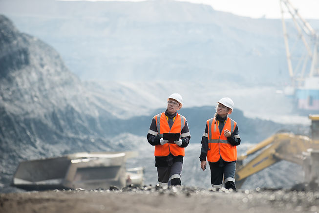 Workers with coal at open pit.jpg