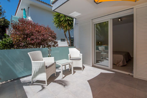 Sliding shutters darken the bedroom