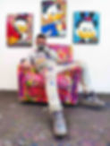 Discover an exclusive photo of the renowned street artist Vincent Bardou in his studio, surrounded by his unique creations featuring Scrooge McDuck. This behind-the-scenes glimpse showcases Bardou's distinctive style, blending street art and pop culture. Explore how Bardou's innovative use of acrylics, oils, and aerosols brings iconic characters to life. Witness the creative process of one of the most celebrated artists in contemporary art, as he transforms classic cartoon figures into striking, one-of-a-kind masterpieces.