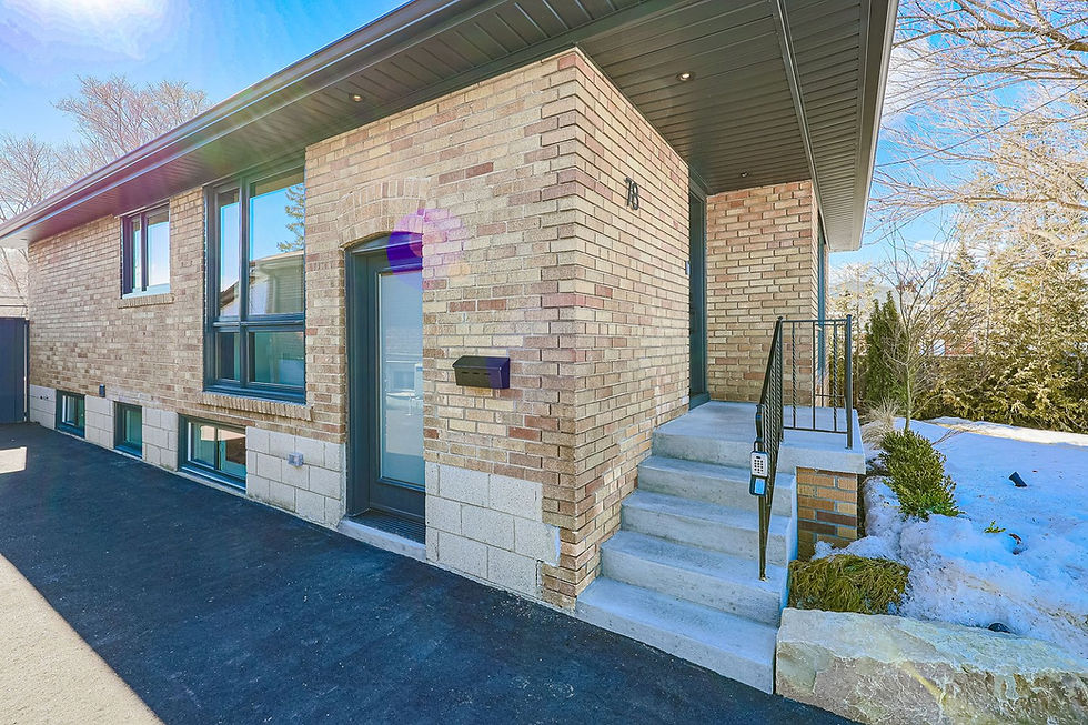 Toronto brick house with separate basement apartment entrance after building permit approval.