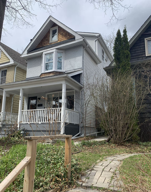 Existing front view of the house on Grandview Avenue before the home addition, showing original porch and exterior.