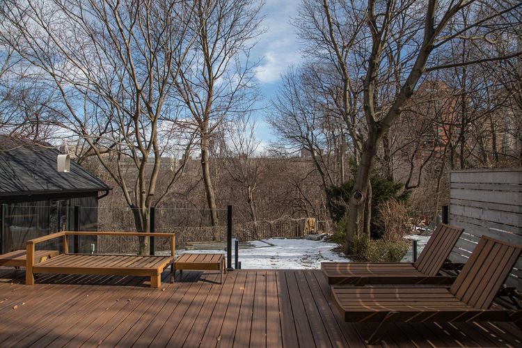 Completed rear deck of Forest Hill home with modern railing and outdoor seating.