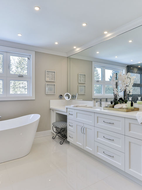 Modern ensuite bathroom with freestanding tub and glass shower from West Point Toronto permit drawings for interior renovation.